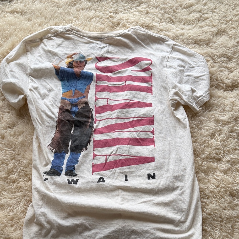 Shaina Twain Stylish White Graphic Tee with Pink and Blue Accents